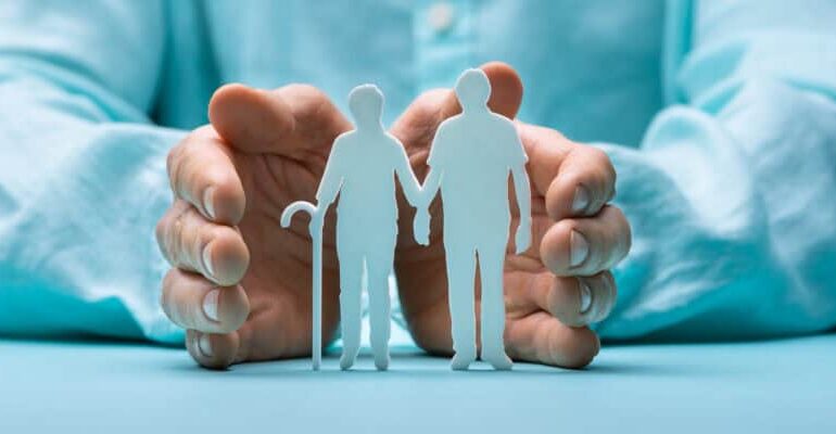 Hand Protecting Senior Couple